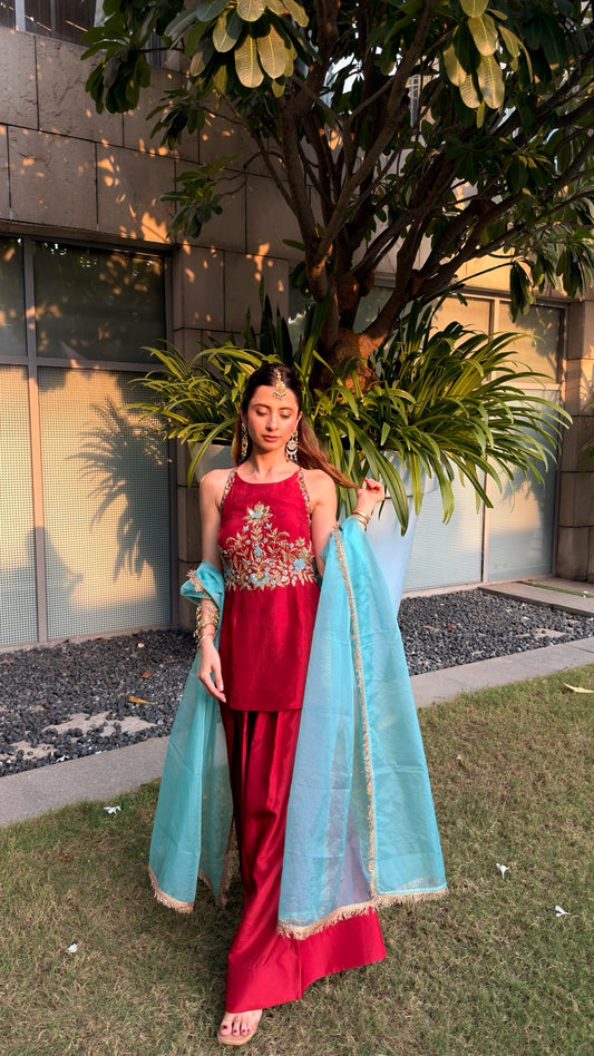 Gul-e-Neel Farshi Sharara in red with floral embroidery and contrasting blue dupatta